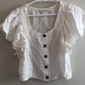 White blouse with flutter sleeves